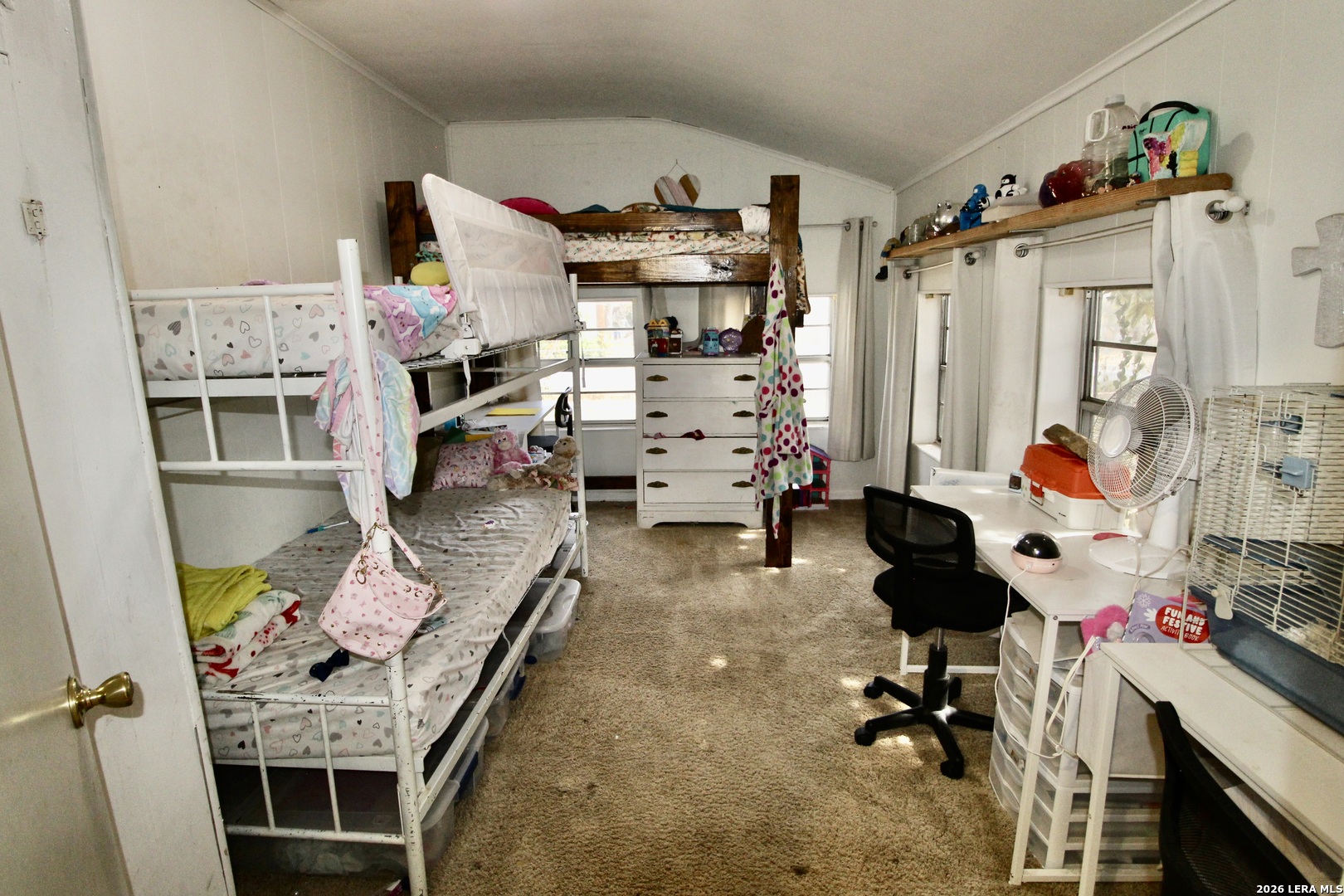 19231 Benton Lytle, TX 78052 - Photo 25 of 34 a bedroom with furniture and a baby crib