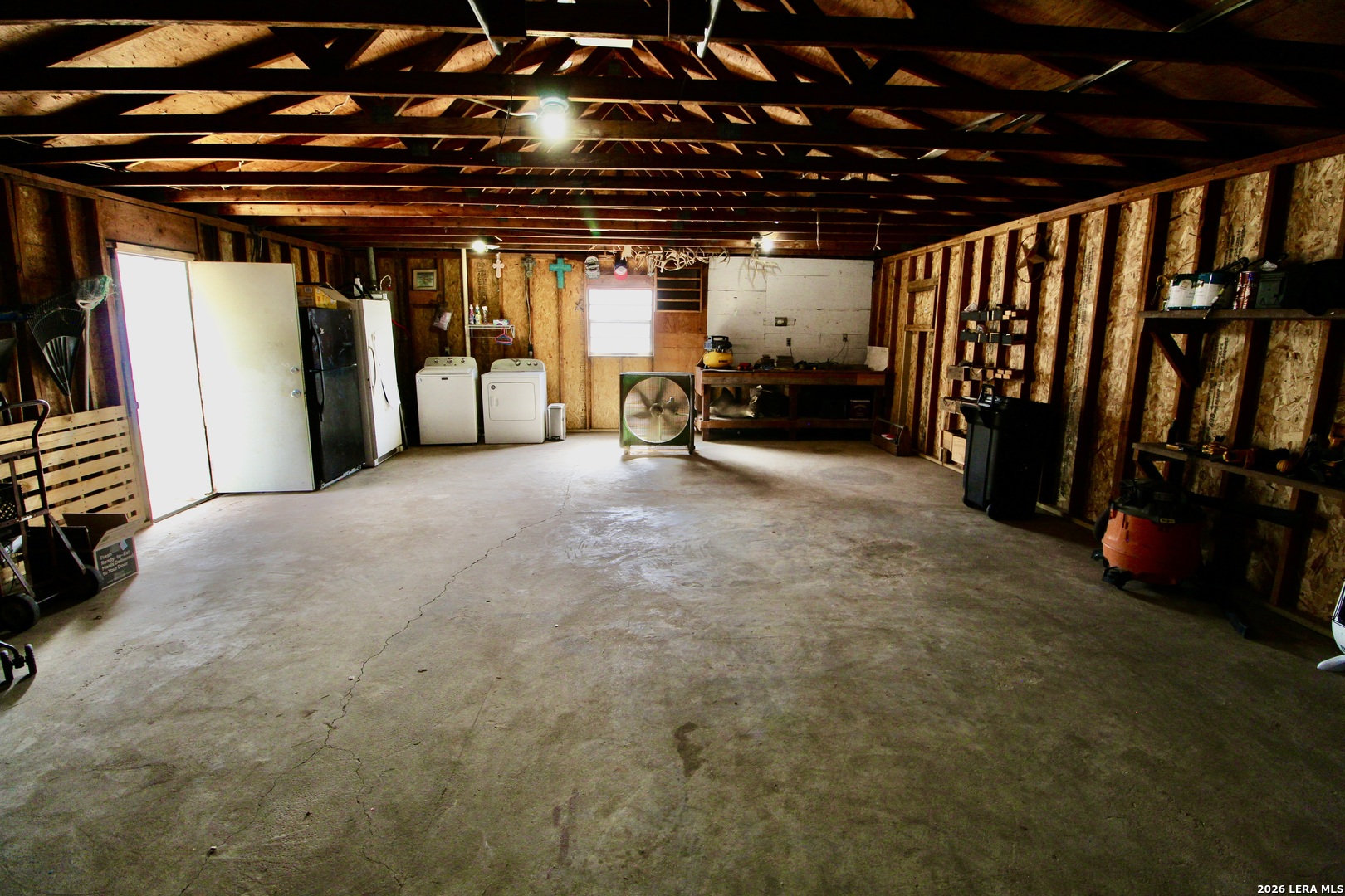 19231 Benton Lytle, TX 78052 - Photo 32 of 34 a view of an empty room with lots of gym equipment
