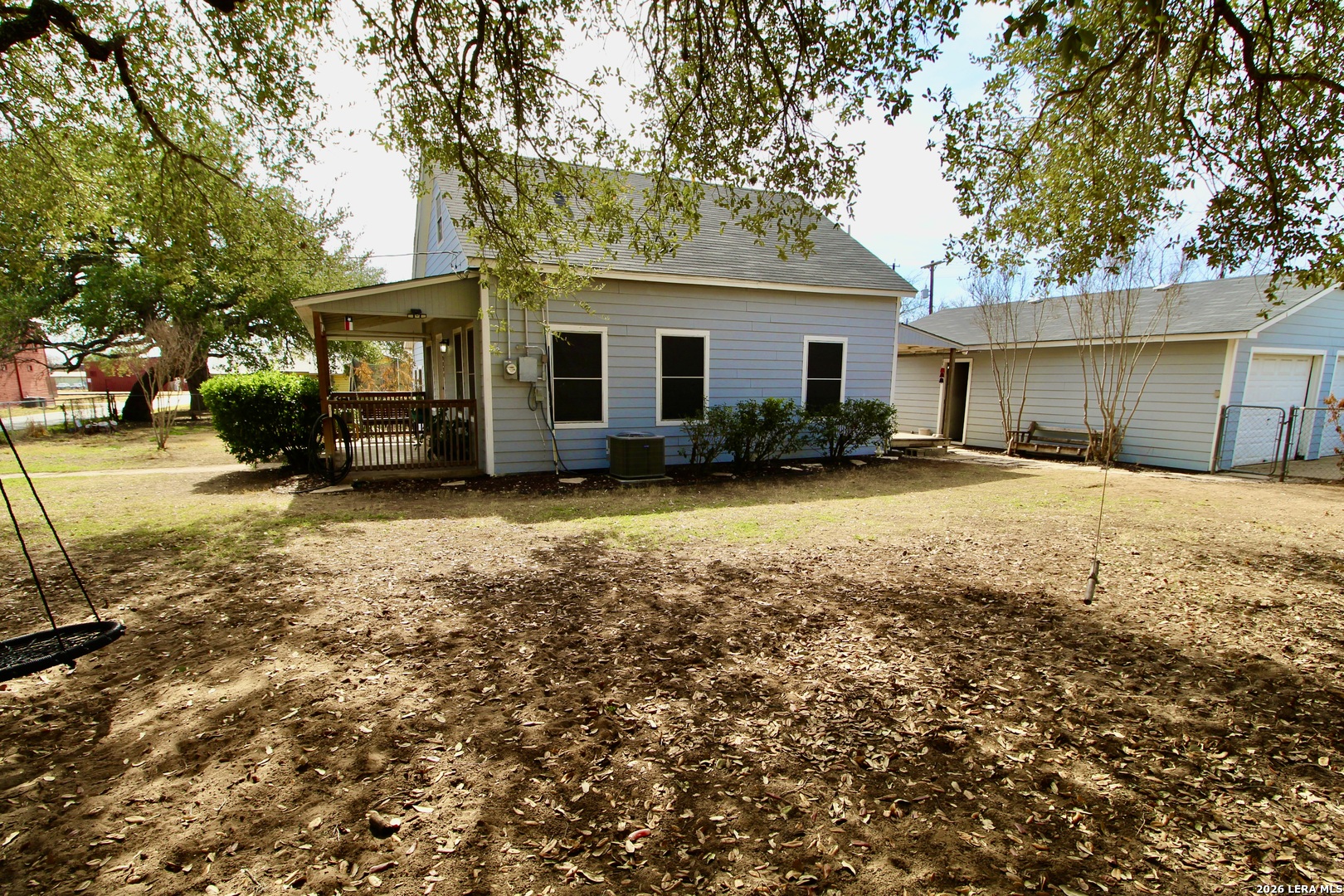 19231 Benton Lytle, TX 78052 - Photo 5 of 34 a view of a house with a yard covered with snow