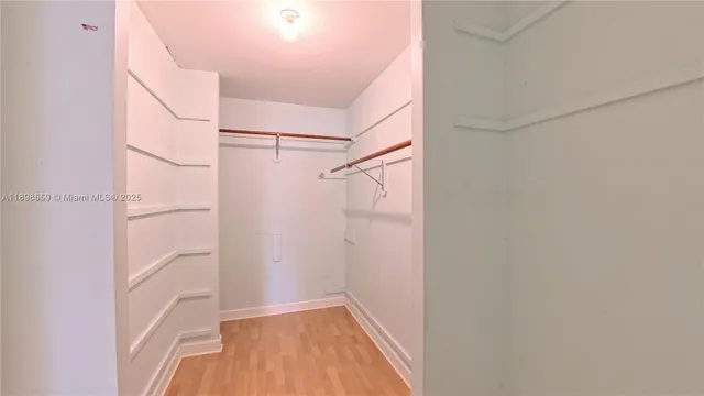 a view of an empty walk in closet