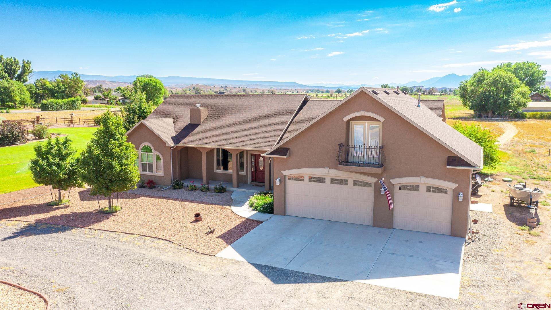 8460 1950th Road Austin, CO 81410 - Photo 25 of 35 a view of a house with a backyard