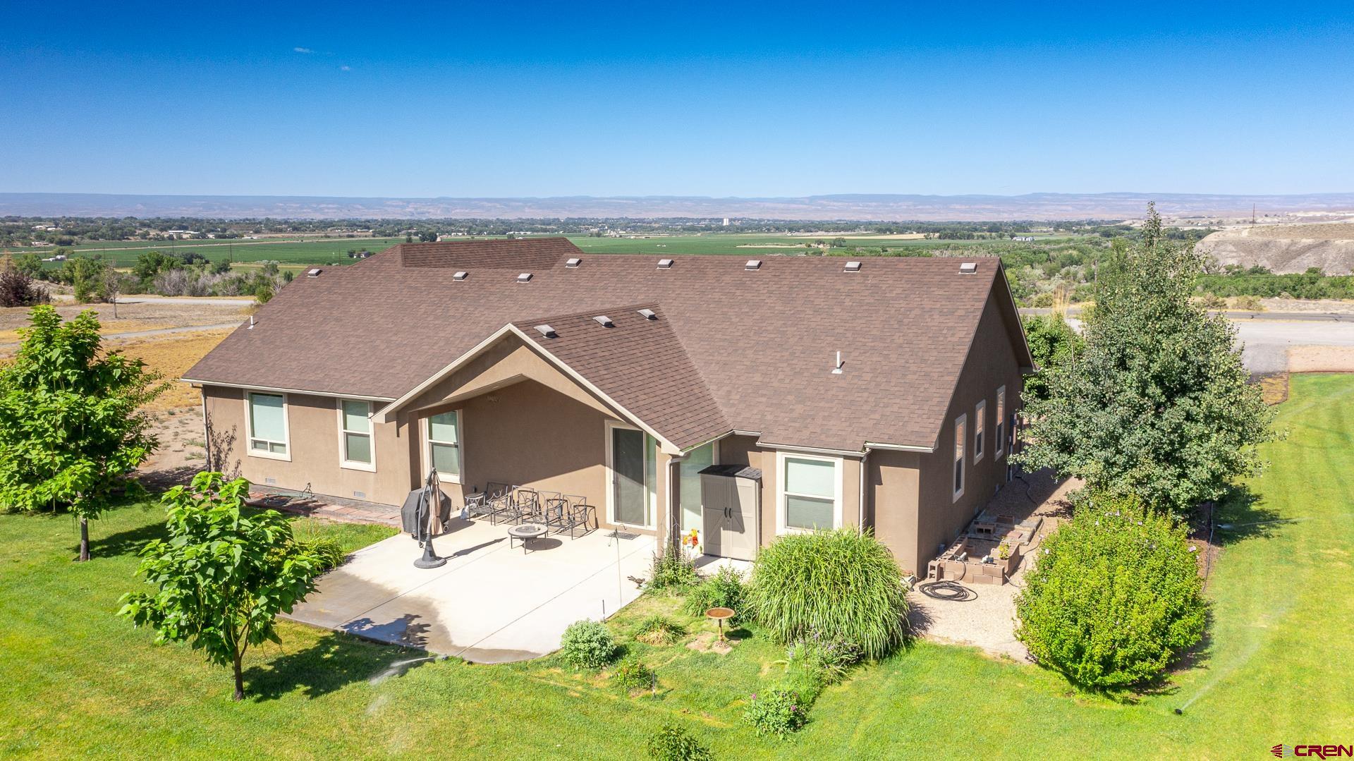 8460 1950th Road Austin, CO 81410 - Photo 26 of 35 front view of a house with a yard