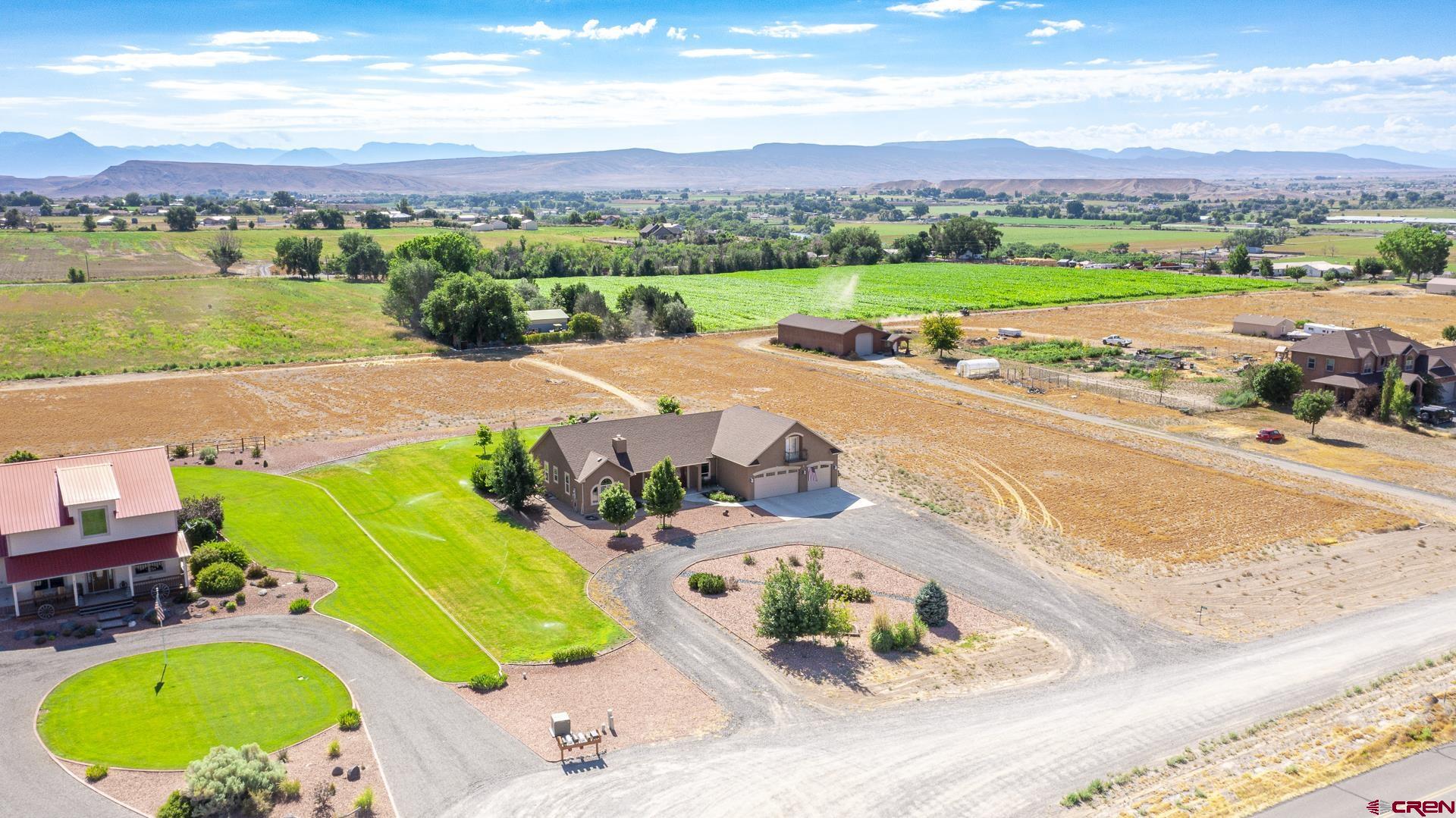 8460 1950th Road Austin, CO 81410 - Photo 31 of 35 an aerial view of a swimming pool with a yard
