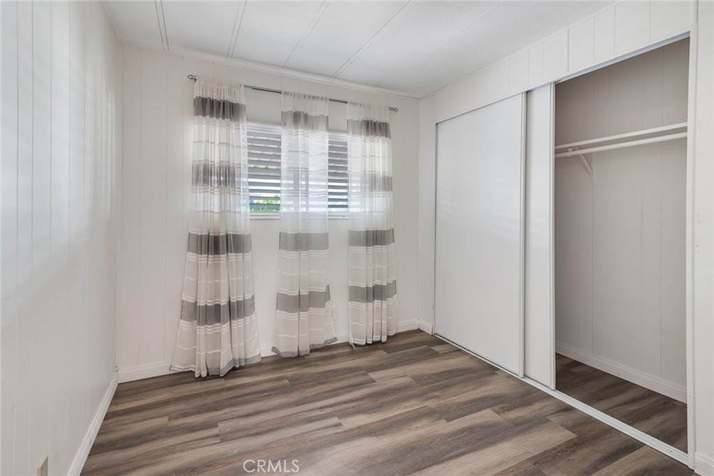 4000 Pierce, Unit 295 Riverside, CA 92505 - Photo 11 of 29 a view of wooden floor and windows in a room