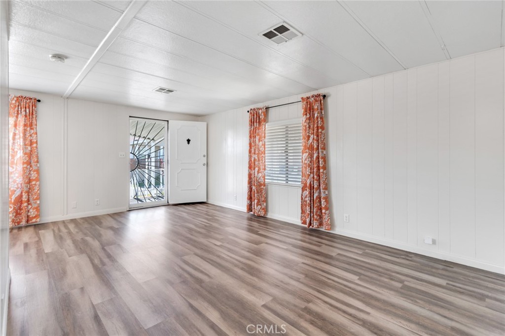 4000 Pierce, Unit 295 Riverside, CA 92505 - Photo 5 of 29 wooden floor in an empty room with a window