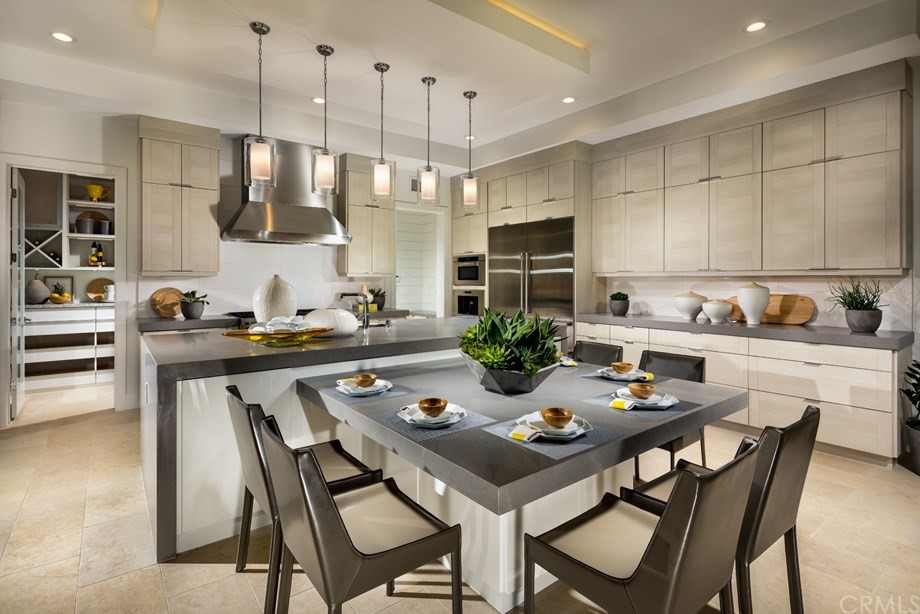 58 Gravity Irvine, CA 92618 - Photo 4 of 8 a kitchen with a dining table and chairs