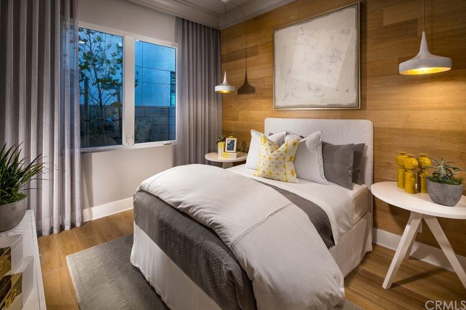 58 Gravity Irvine, CA 92618 - Photo 8 of 8 a bedroom with a bed and a chandelier