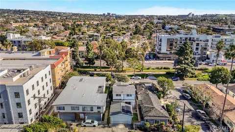 a brick building with a small yard
