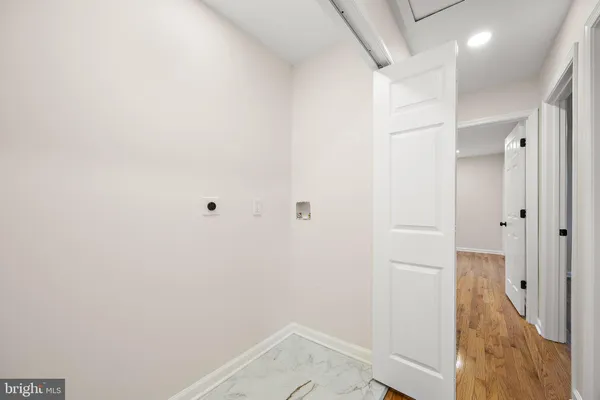 a view of wooden floor and windows in a room