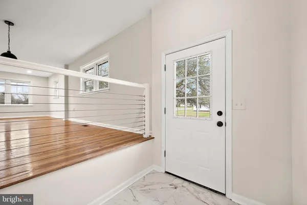 a view of a bathroom with sink and mirror