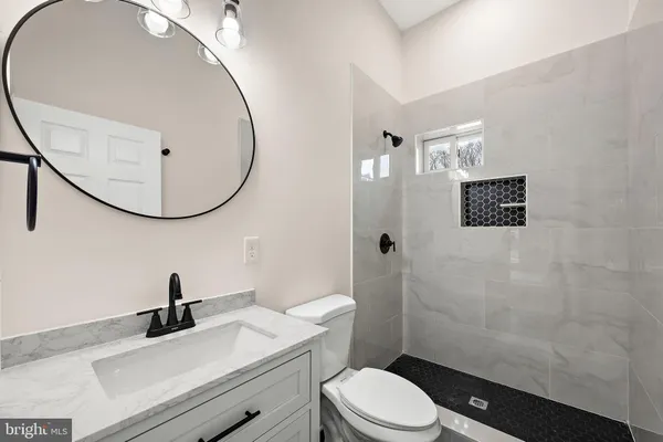 a view of an empty room with gym equipment