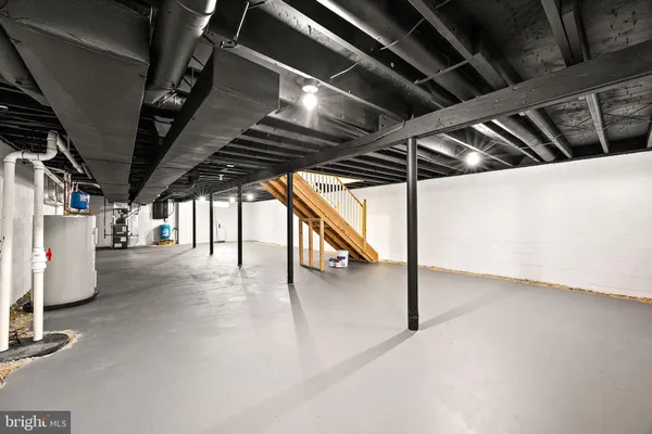 a view of an empty room with stairs