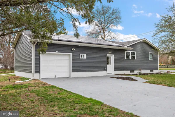 a backyard of a house with yard and garage