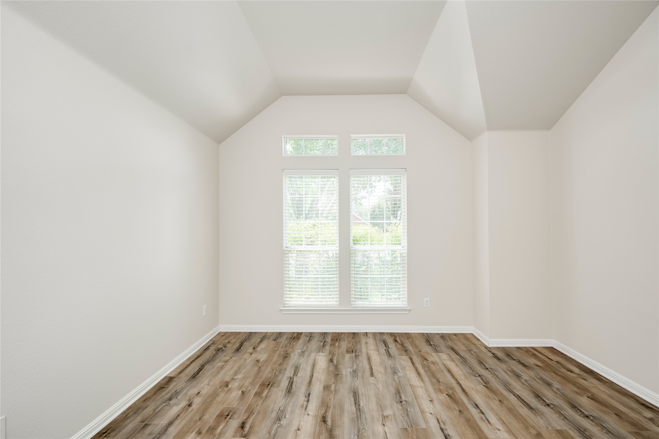 1813 Nelson Ranch Loop Cedar Park, TX 78613 - Photo 5 of 39 Natural light floods this room, highlighting the beautiful wood flooring and high vaulted ceilings.