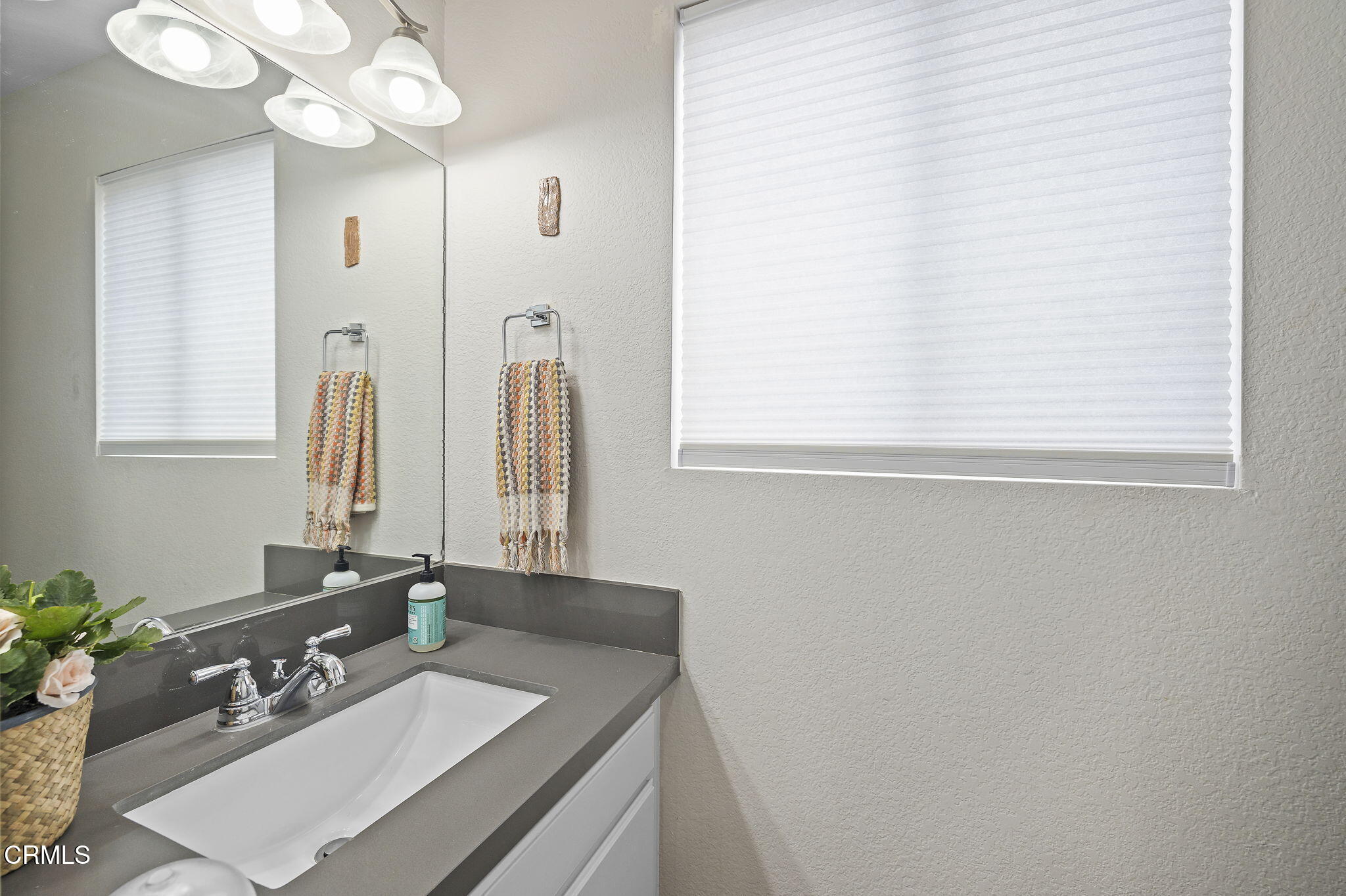 1052 Seco Street, Unit 206 Pasadena, CA 91103 - Photo 15 of 35 a bathroom with a sink vanity granite and a mirror