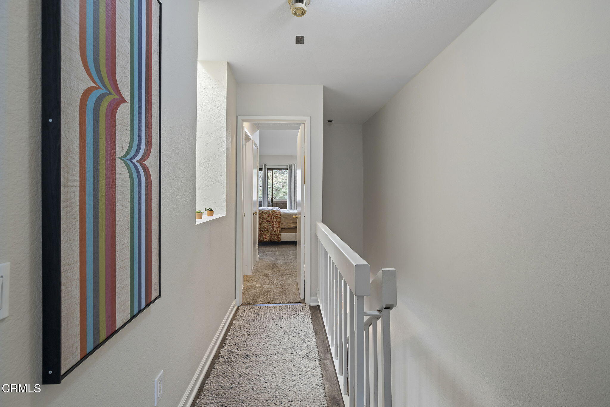1052 Seco Street, Unit 206 Pasadena, CA 91103 - Photo 16 of 35 a view of a hallway with a white walls