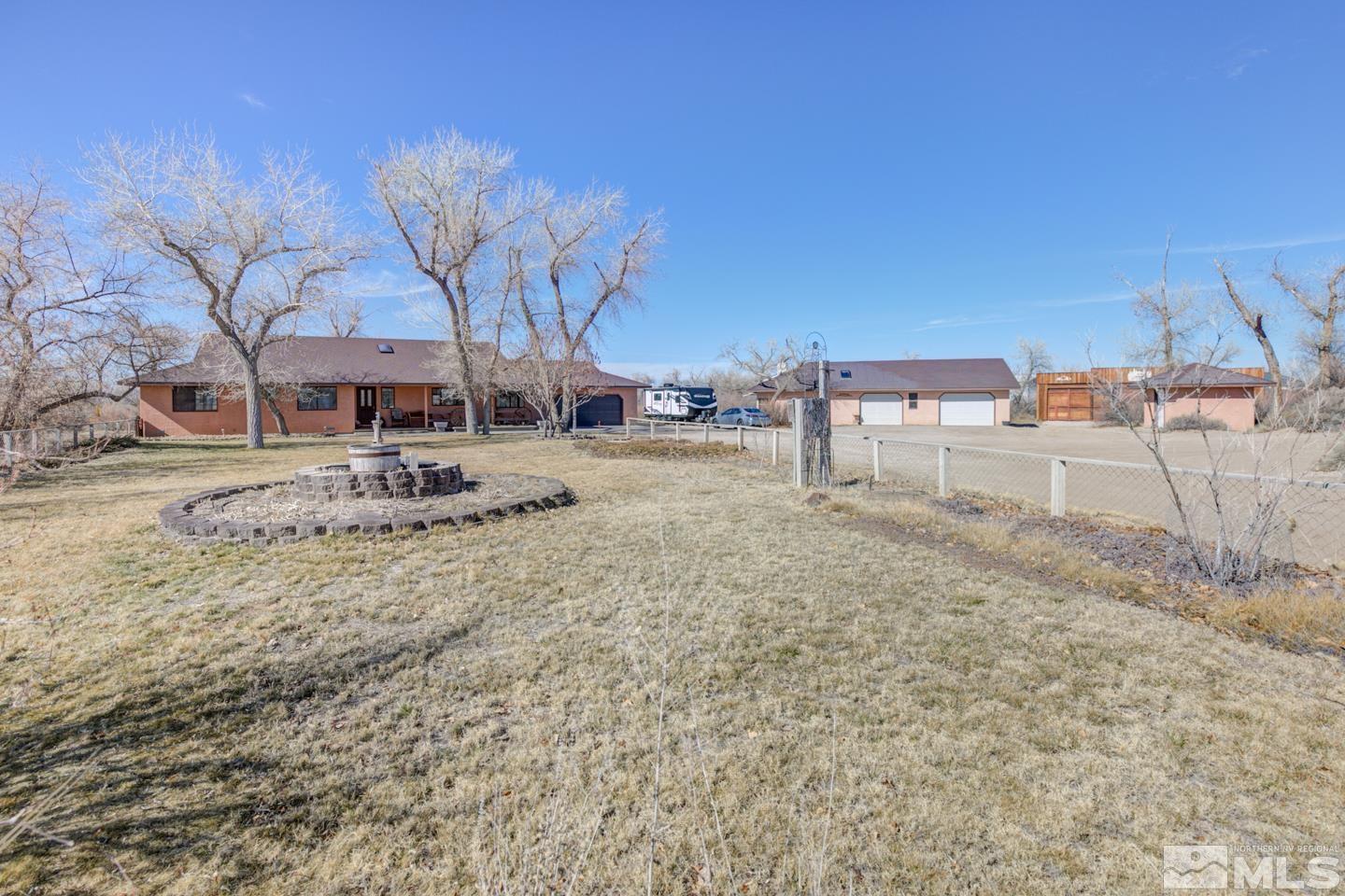 3812 Boyer Road Fallon, NV 89406 - Photo 1 of 40 a backyard of a house with table and chairs