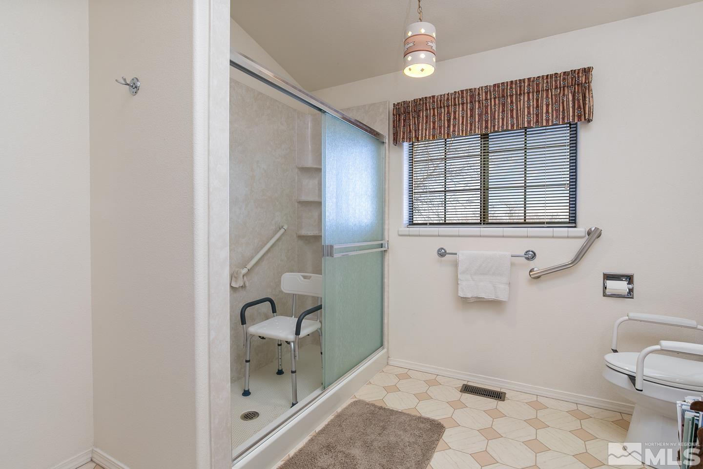 3812 Boyer Road Fallon, NV 89406 - Photo 14 of 40 a bathroom with a bathtub and a shower