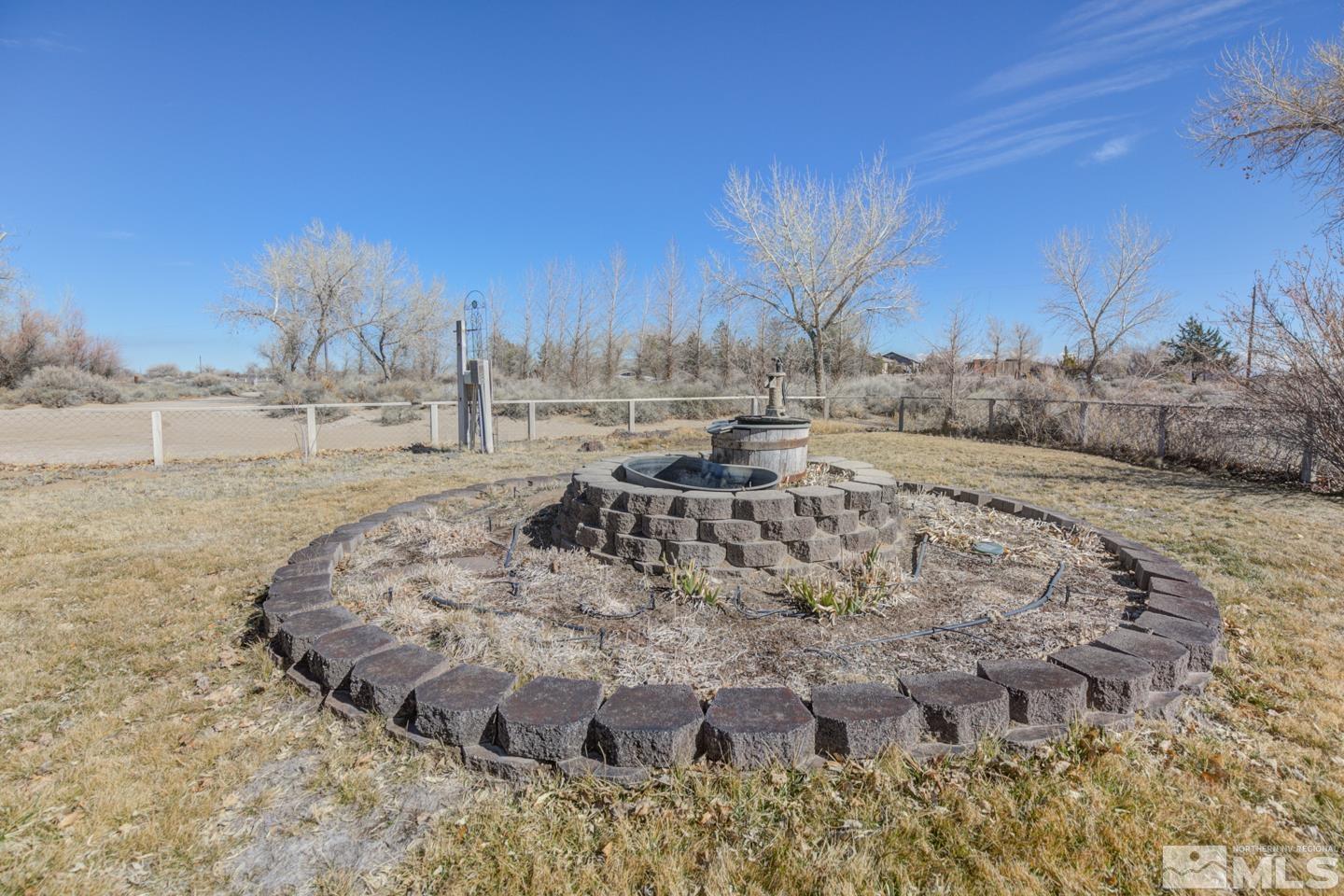 3812 Boyer Road Fallon, NV 89406 - Photo 18 of 40 a view of a dry yard with wooden fence