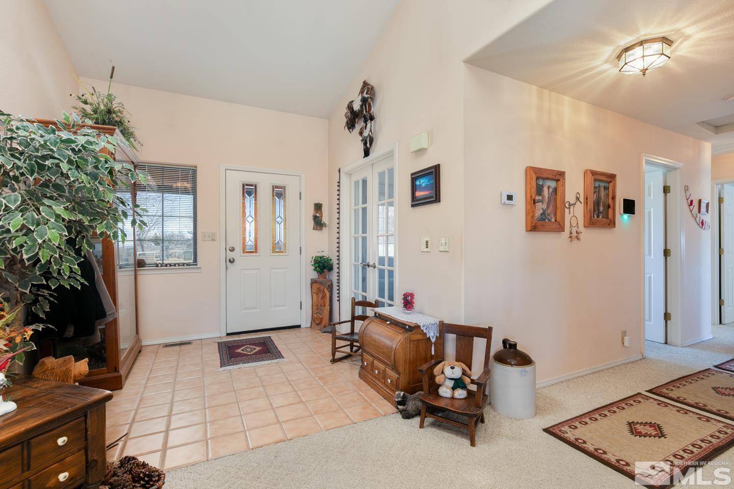 3812 Boyer Road Fallon, NV 89406 - Photo 2 of 40 a bedroom with furniture and a chandelier