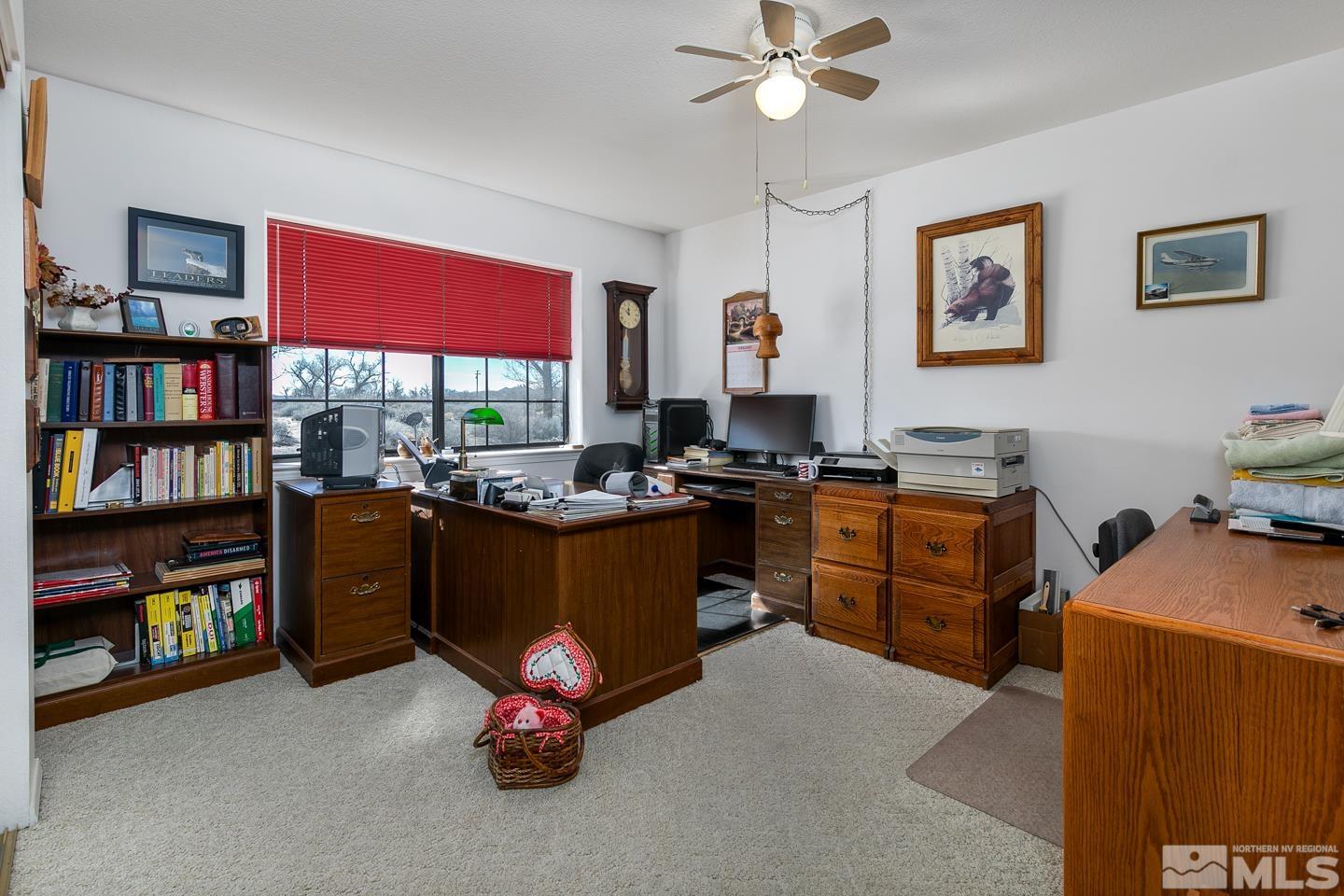 3812 Boyer Road Fallon, NV 89406 - Photo 10 of 40 a bedroom with furniture cabinet and a flat screen tv
