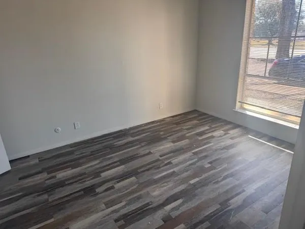 a view of an empty room and window