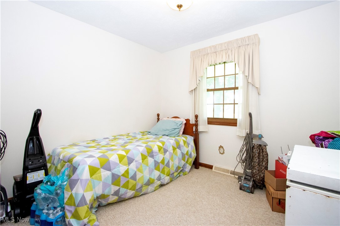1292 Cinder Road Southeast Carrollton, OH 44615 - Photo 35 of 42 Bedroom featuring carpet floors and baseboards