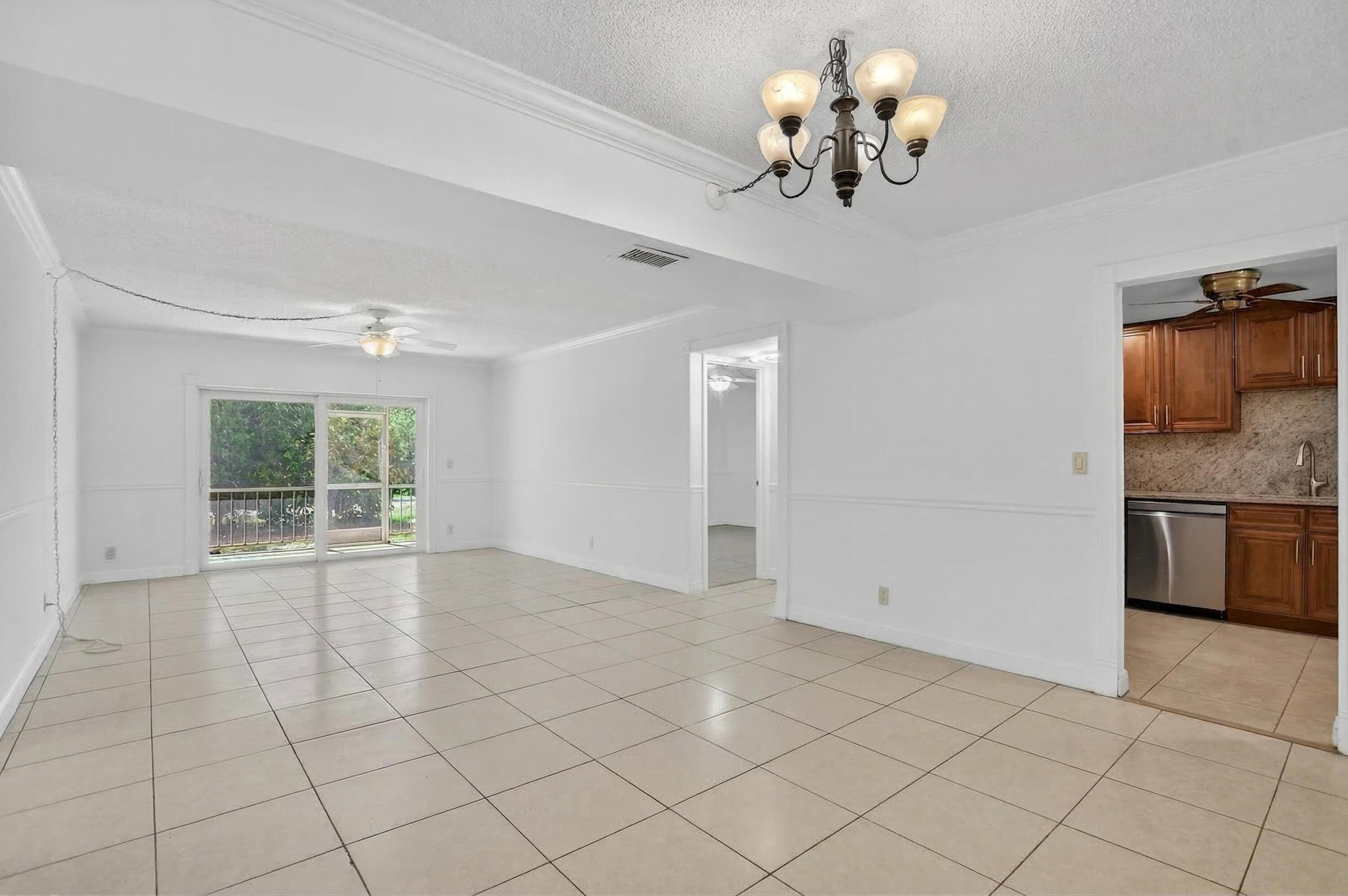 636 Northwest 13th Street, Unit 110 Boca Raton, FL 33486 - Photo 3 of 35 a view of an empty room with a window