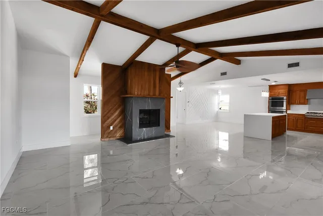 a view of a livingroom with furniture and fireplace