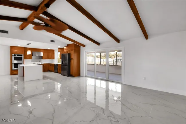 a view of a livingroom with furniture and windows