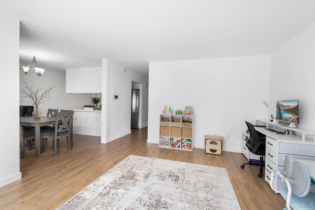 1640 Maple Drive, Unit 53 Chula Vista, CA 91911 - Photo 14 of 52 a living room with furniture and a wooden floor