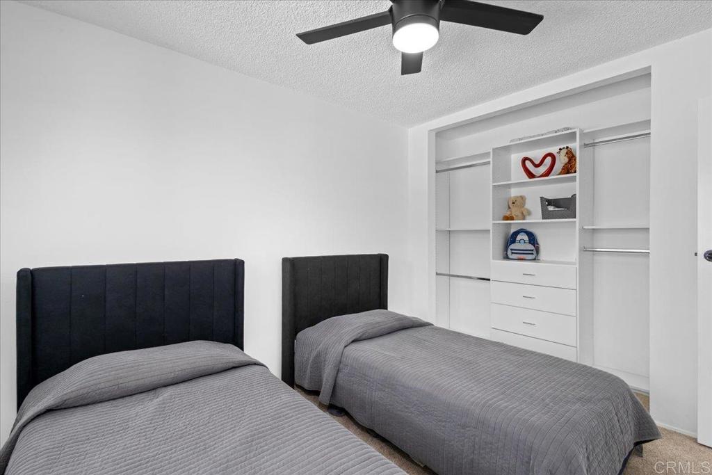 1640 Maple Drive, Unit 53 Chula Vista, CA 91911 - Photo 18 of 52 a bedroom with two beds and painting on the wall