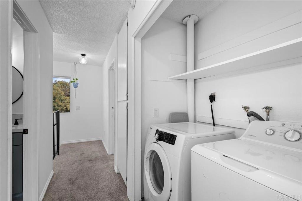 1640 Maple Drive, Unit 53 Chula Vista, CA 91911 - Photo 19 of 52 a view of washer and dryer with bathroom in the background