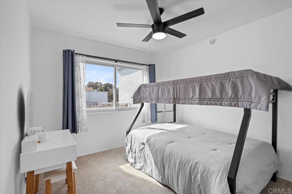 1640 Maple Drive, Unit 53 Chula Vista, CA 91911 - Photo 21 of 52 a bedroom with a bed and a large mirror