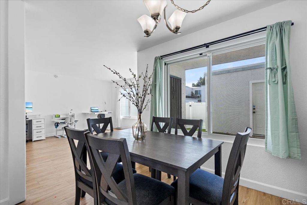 1640 Maple Drive, Unit 53 Chula Vista, CA 91911 - Photo 4 of 52 a view of a dining room with furniture and wooden floor