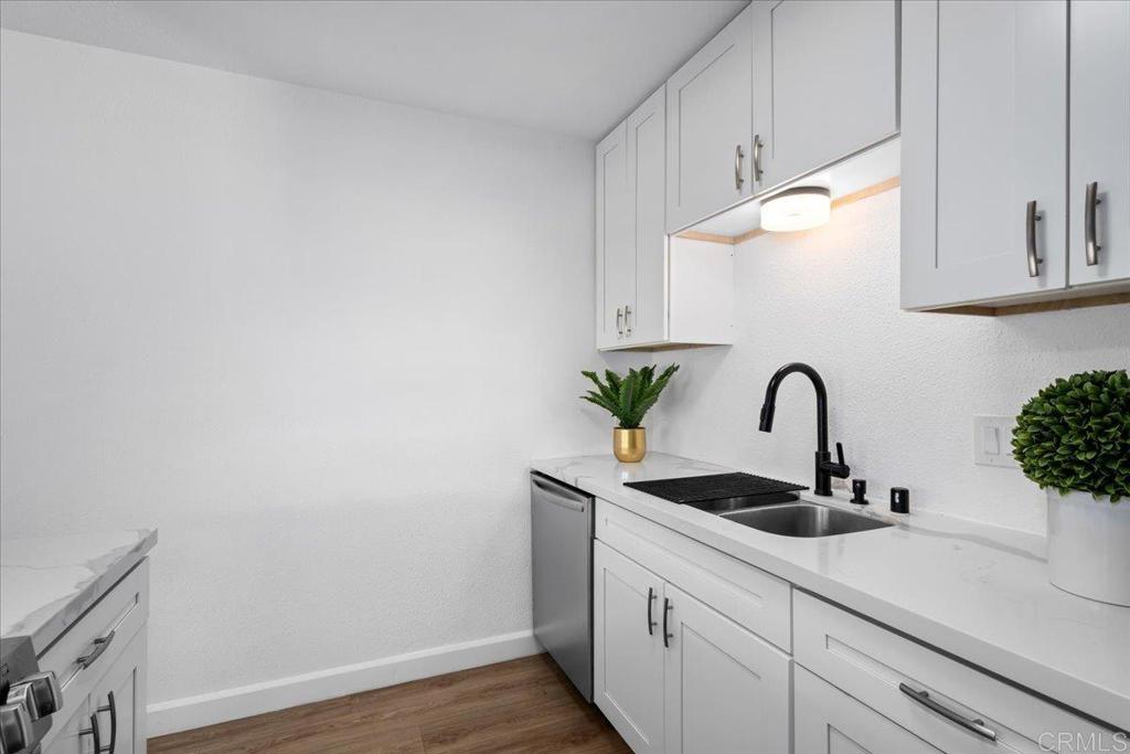 1640 Maple Drive, Unit 53 Chula Vista, CA 91911 - Photo 7 of 52 a kitchen with a sink and cabinets