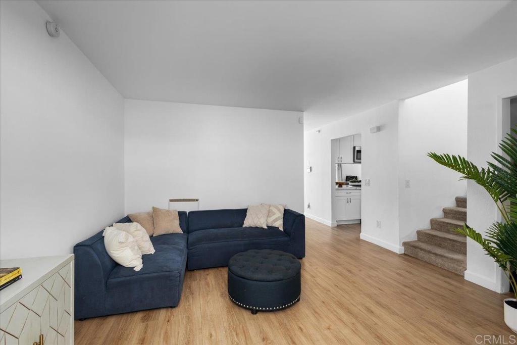 1640 Maple Drive, Unit 53 Chula Vista, CA 91911 - Photo 8 of 52 a living room with furniture and wooden floor