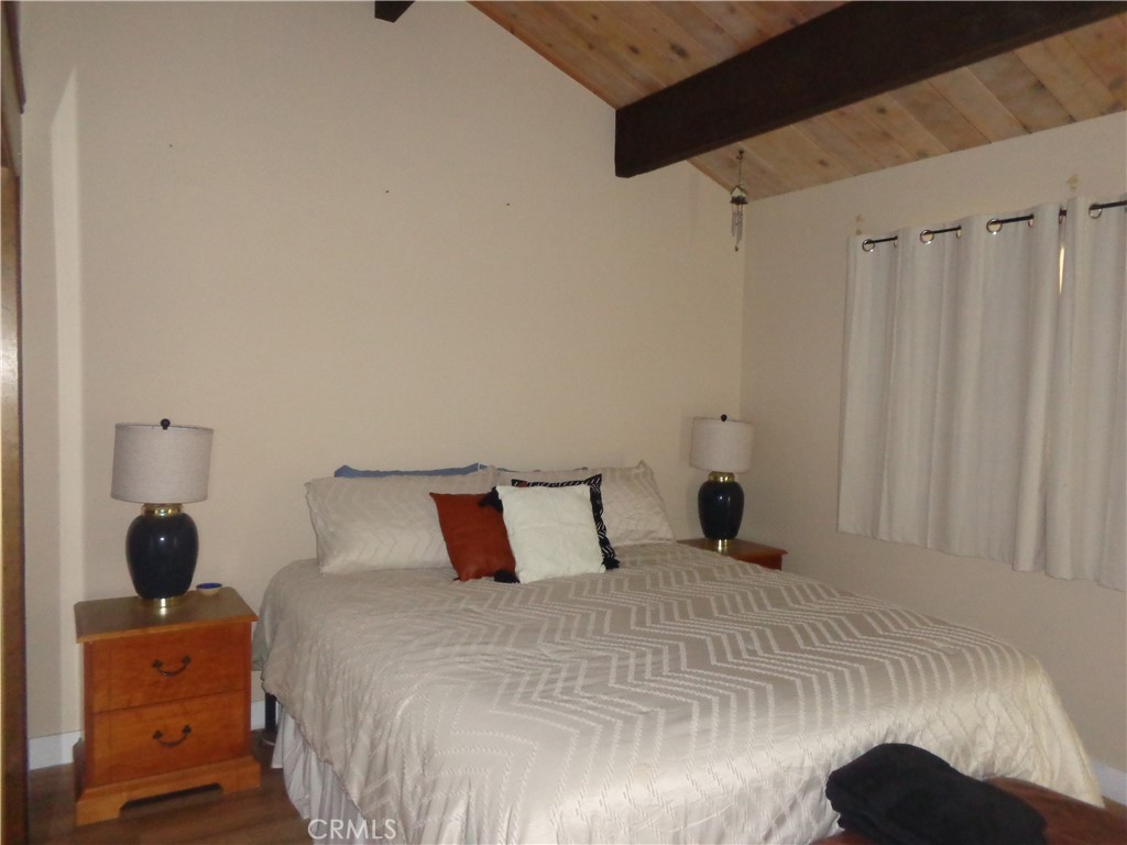 24273-24273 Horst Drive Crestline, CA 92325 - Photo 13 of 34 a bedroom with a bed and a window