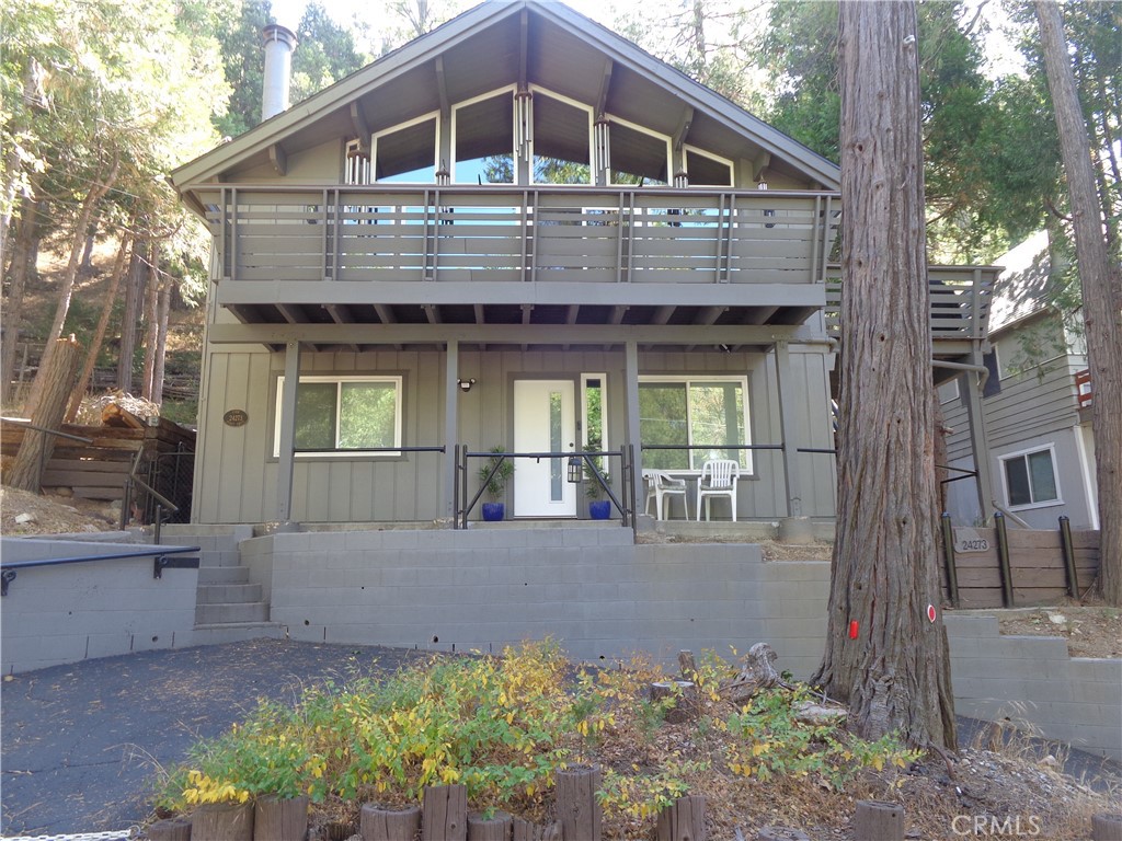 24273-24273 Horst Drive Crestline, CA 92325 - Photo 2 of 34 a front view of a house with a yard