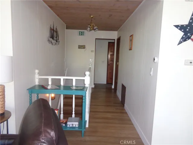 a kitchen with a refrigerator and a sink