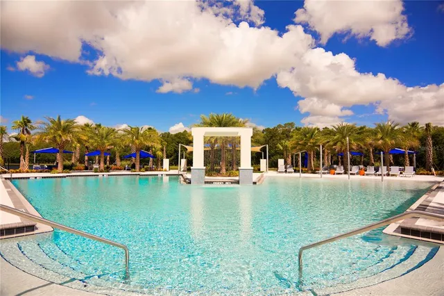 a view of swimming pool with outdoor seating
