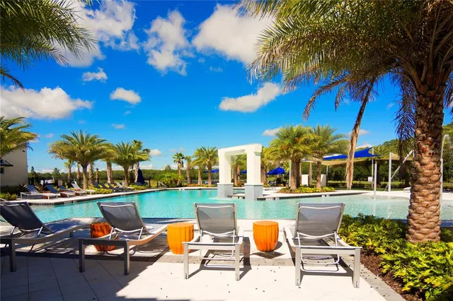 a lobby with furniture and floor to ceiling window