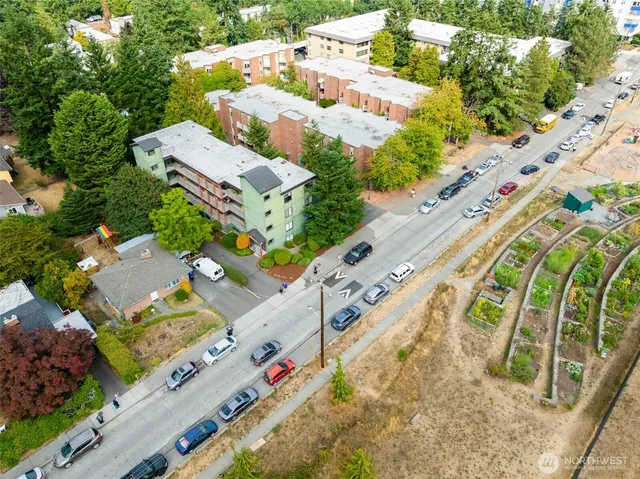 an aerial view of a residential houses with outdoor space