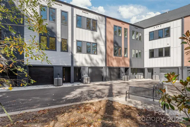 a view of a building with a bench in front of building