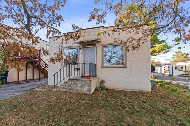 a view of a garage with a tree