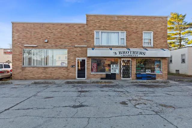 a view of a building with sitting area