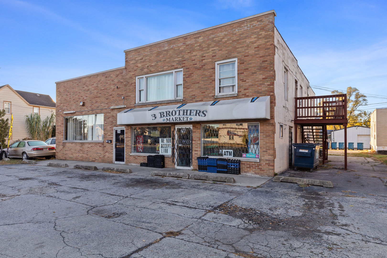 242-244 East Jeffery Street Kankakee, IL 60901 - Photo 4 of 15 a view of a house with a patio and a yard