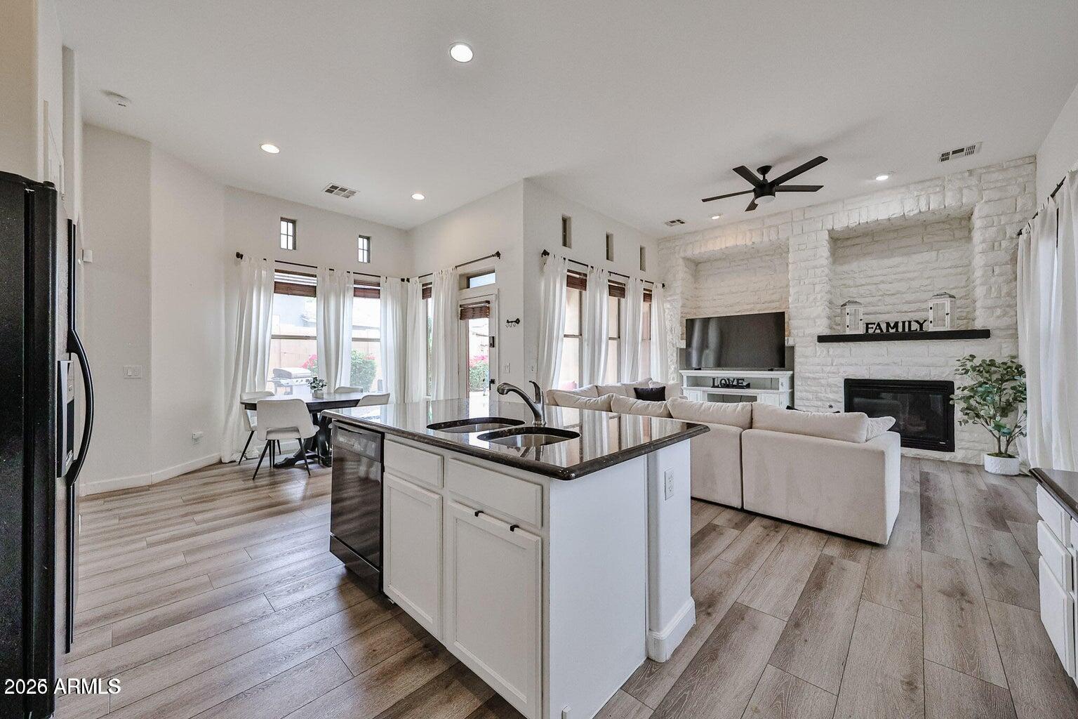 3950 North Edith Way Buckeye, AZ 85396 - Photo 11 of 32 a kitchen with stainless steel appliances granite countertop a stove oven and a refrigerator