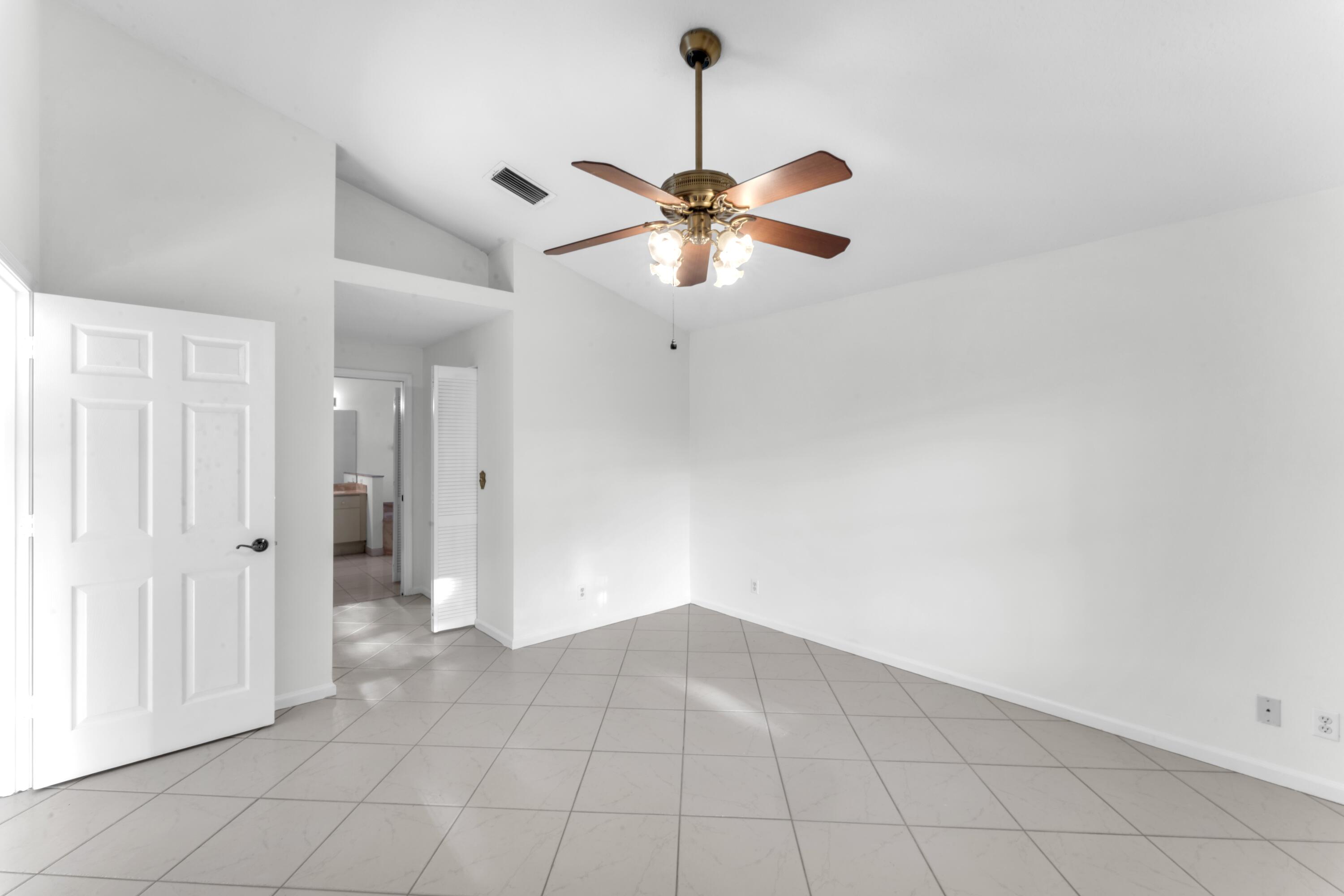 2705 Pointe Circle Greenacres, FL 33413 - Photo 14 of 46 Primary Bedroom