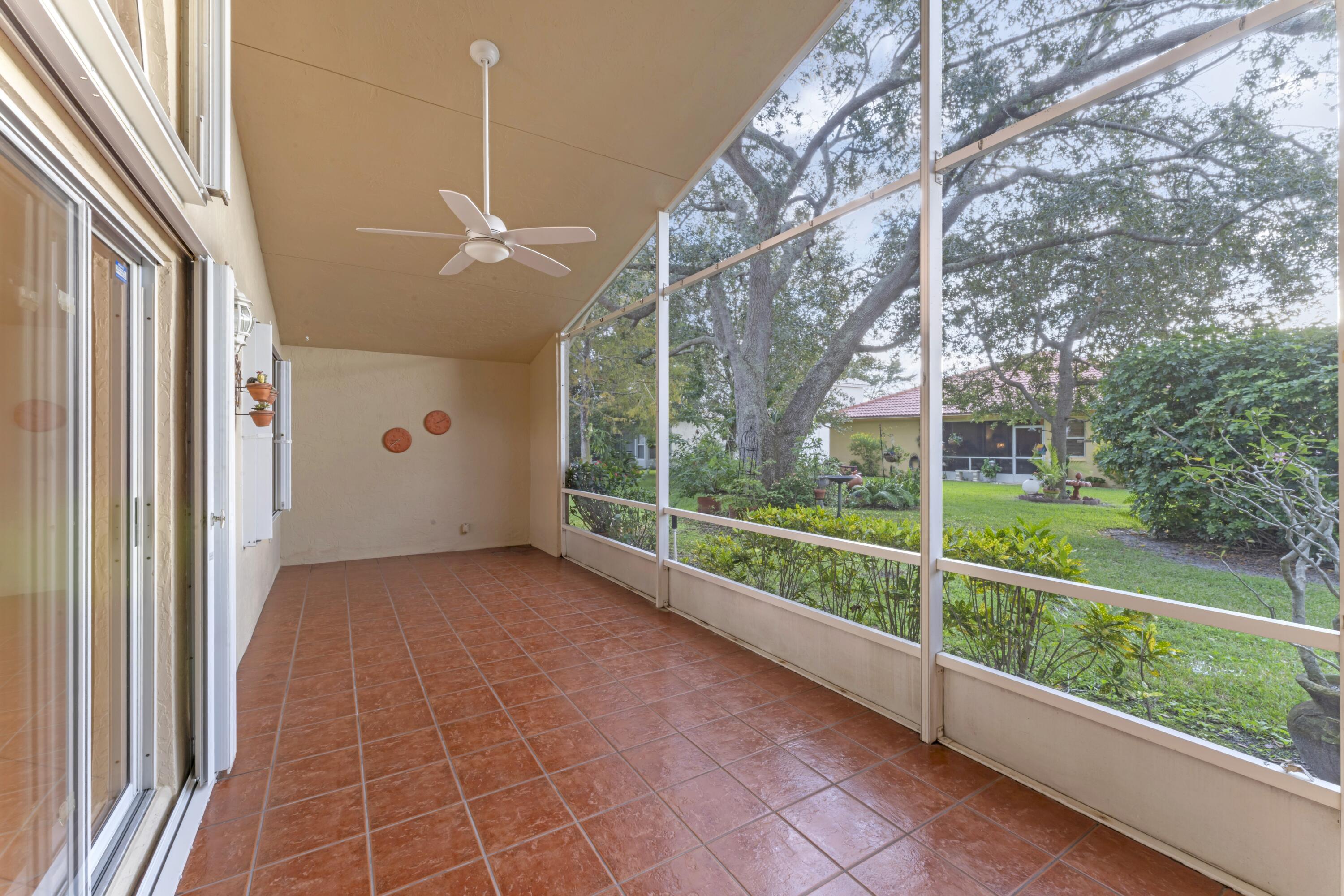 2705 Pointe Circle Greenacres, FL 33413 - Photo 29 of 46 Screened Patio